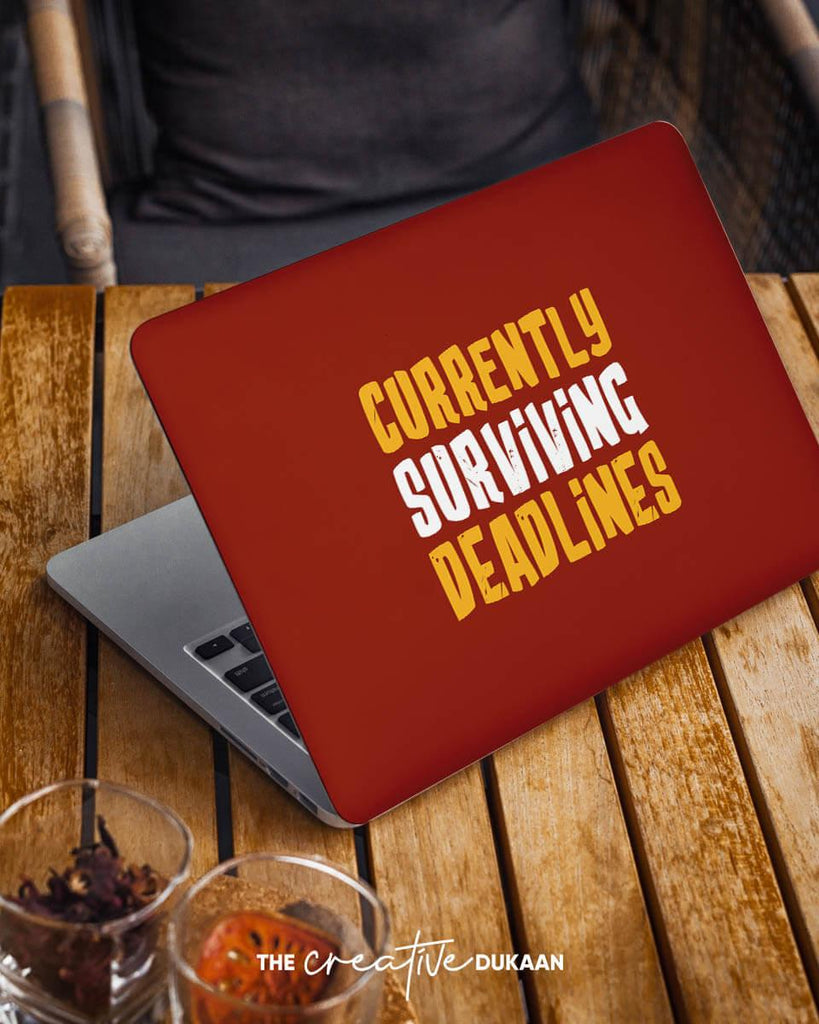 Funny Laptop Skin With The Text "Currently Surviving Deadlines" - Creative Dukaan
